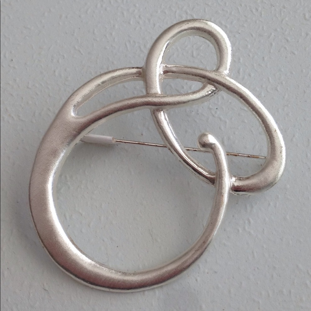 Pin in a Lightweight Silver Metal Swirl Design